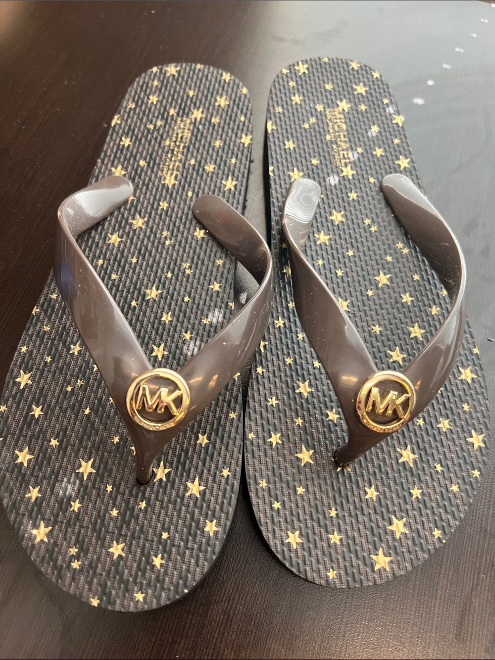 Michael Kors Black Flip Flops with Gold Star Print